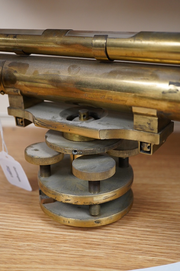 A late 19th century lacquered brass level, by R.W. Street & Co., Commerce Rd., Lambeth, with an incorporated 16 inch telescope, with an ash tripod, uncased, 41cm long